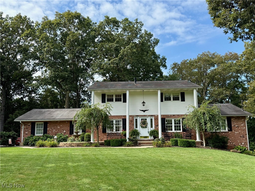PRIDE OF OWNERSHIP SHOWN HERE! A beautifully remodeled home offering the perfect blend of modern updates and spacious outdoor living on a partially wooded .92 Acre lot. Turn the key and move right into this charming 4-bedroom, 2.5 bath home in a neighborhood of large homes in a peaceful wooded setting surrounded by natural beauty all around. Upon entering the stylish front entryway into the large open living room bathed in natural light with the bay window that flows effortlessly into a formal dining room with a crystal chandelier is the "heart of the Home", the updated kitchen with a central island/breakfast bar. Just look at those abundant custom oak cabinets with slide-out shelves, walk-in pantry, "Sub-Zero" refrigerator front door which matches the cabinets, complete appliance package & sleek countertops for all your culinary creativity. Ensuring seamless interaction between guests and hosts is the kitchen cut-out design to a family room with a natural Stone fireplace with reclaimed wood-look Mantle. Glass slides open to a 2-tier expansive deck overlooking a well-cared for backyard landscaped where you can soak in the serene trimmed woods' tranquility. Versatile office space (4th bedroom) provides perfect work from home set-up/study. Main floor laundry/half bath with washer/dryer included. Primary bedroom has a huge walk-in closet with custom made drawers. Two bedrooms upstairs are generously sized with ceiling fans & calming colors. Remodeled bathroom with custom-built cabinets. Lower level unfinished high-ceiling basement with walk-out access offers possibilities for your decorative touch. Garage door entry for car enthusiasts & workshop bench setup. New 200 AMP service. Rainbird irrigation system. New septic system installed in July 2025.Well-built foundation walls with rebar & 8" block center wall. Long time home for over 50 years and now you can create your own dreams here & discover the charm of this rermarkable updated home in WARREN SCHOOL DISTRICT!