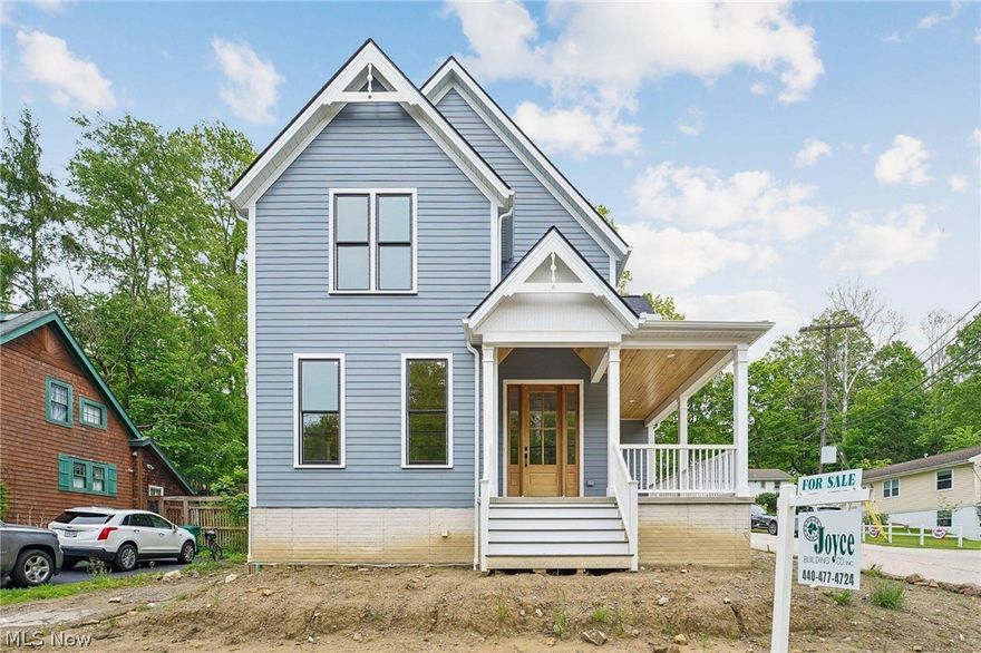 Welcome to this rare opportunity to own a charming new home in the heart of Historic Chagrin Falls. This property , features 4 spacious bedrooms with walk-in closets and 4 en suite baths. Enjoy cooking in the kitchen with custom cabinets, Thermador appliances and stone countertops. The dining area has direct access to the yard through sliding patio door and deck. Enjoy the family room with beamed ceilings and gas fireplace. The lower level features custom cabinetry and bar with beverage refrigerator. With an abundance of trim detail, built-ins, and crown molding, the home feels refined and intentionally designed. The property includes a 3 car attached, heated garage and a spacious yard for entertaining. Conveniently located walking distance to Chagrin Falls shops and dining.