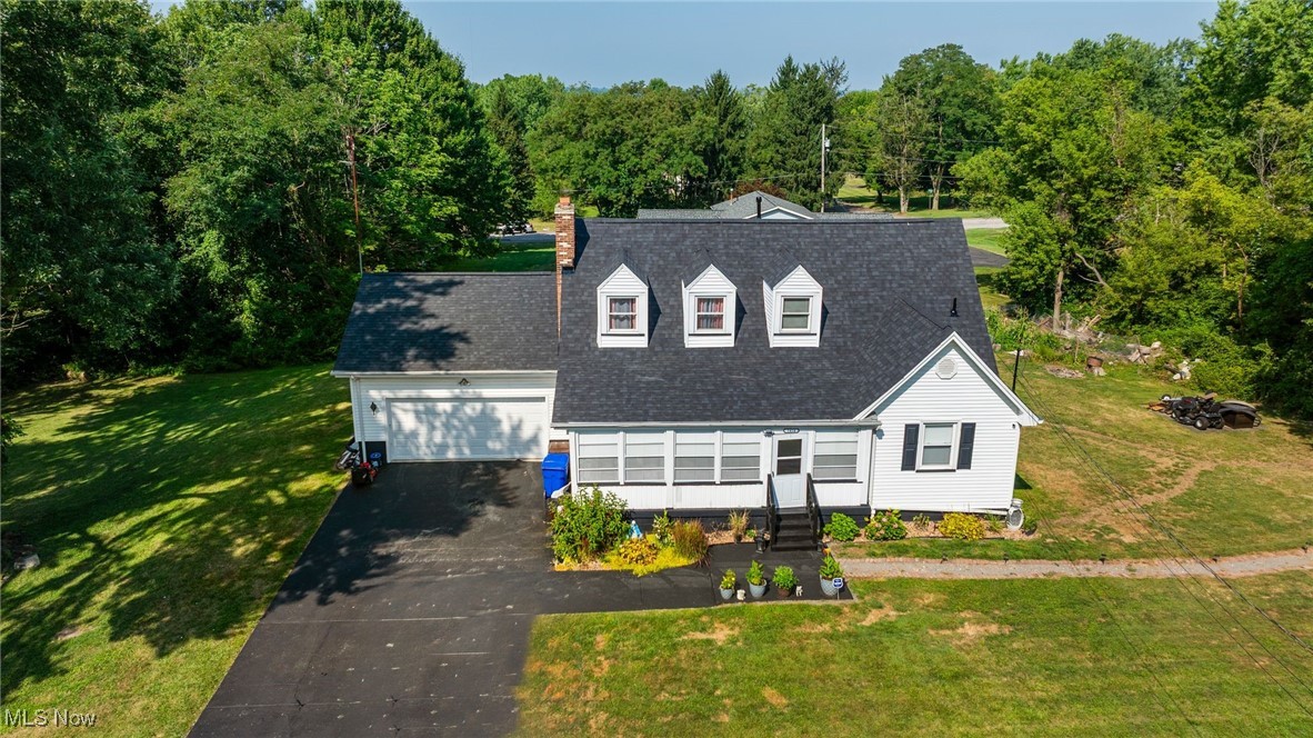 Welcome to 1414 Overlook Avenue, Tucked away on a quiet dead-end street, this charming 4-bedroom, 2-bath Cape Cod is more than just a house — it’s a place to call home. With thoughtful updates throughout, you can move right in and start making memories from day one.
Imagine sipping your morning coffee on the enclosed front porch, then stepping inside to a bright, open-concept living, dining, and kitchen area. The seamless flow, new flooring, and natural light make it a space where family and friends naturally gather. The kitchen is both stylish and practical, with reverse osmosis systems, plenty of counter space, and a door that leads to the back deck — perfect for summer cookouts and evening sunsets to enjoy in almost an acre of land.
The main level included One bedroom and a full bathroom for comfort and upstairs, you’ll find three comfortable bedrooms and a full bath, giving everyone their own space while still keeping the home cozy and inviting.
The walk-out basement adds room to grow — whether you dream of a hobby space, gym, or extra living area — and the sump pump system provides peace of mind. Outside, you’ll love the two back decks, the private yard, and the paved driveway leading to a 2-car garage with a newer door.
Recent big-ticket updates include a 2025 roof, and 2023 furnace, A/C, water tank, and water softener system — all the essentials are taken care of for you. Set in the Struthers School District, this home combines privacy, comfort, and convenience in one beautiful package.
1414 Overlook Ave isn’t just a property — it’s a place to relax, grow, and create the life you’ve been waiting for.
