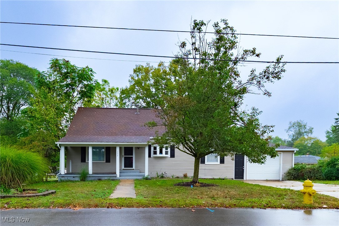 This charming Cape Cod is full of personality, thoughtful updates, and endless potential. Offering both a living room and a family room at this price point is almost unheard of, perfect for hosting large gatherings, holiday celebrations, or cozy nights in.
The oversized eat-in kitchen is right in the middle of it all, making it the true heart of the home. With plenty of cabinets, generous countertop space, and a seamless flow to both living areas, it's every cook's dream and keeps you connected to your guests while you whip up dinner.
A welcoming covered front porch invites you in and makes the perfect spot for sipping your morning coffee or decorating seasonally. An attached one-car garage makes bringing in groceries a breeze and keeps you covered when Ohio weather isn't quite cooperating. Off the family room, step out onto the deck and enjoy your morning coffee overlooking the spacious backyard. Sitting on two parcels totaling nearly 1/3 of an acre, this corner lot means you only have a neighbor on one side- hello privacy!
Inside, you'll find two large bedrooms and a full bath on the main level, complete with brand-new carpet and fresh LVP flooring in the living room. Upstairs offers another generous bedroom with a large closet, giving you flexibility for a guest room, office, or creative space.
The walk-out basement is unfinished and just waiting for your vision - home gym, rec room, workshop, or all of the above! With a newer HVAC system (just 2 years old), peace of mind comes included.
This home truly blends charm, comfort, and potential - all in the heart of Barberton!