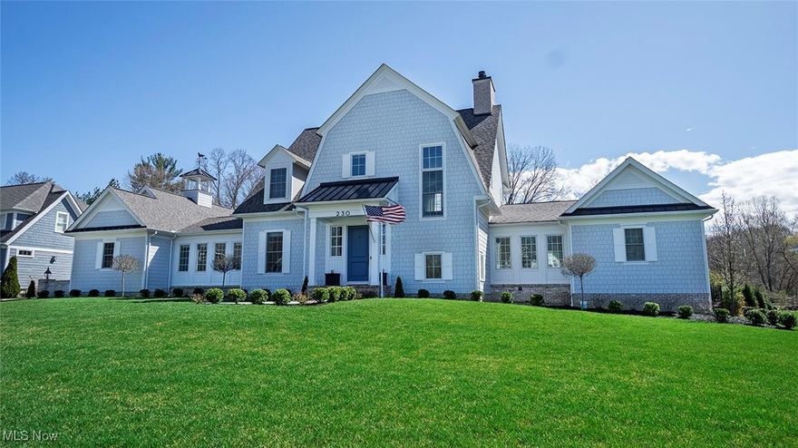 This custom-designed Cape Cod residence seamlessly blends timeless Nantucket charm with modern luxury. Featuring four bedrooms and three and a half baths, its distinctive gambrel roof and cement cedar shake siding exude classic elegance. Step into the welcoming foyer and enter a breathtaking great room, where floor-to-ceiling windows flood the space with natural light. A striking fireplace wall, framed by custom built-in cabinetry, serves as the focal point, while an elegant coffered ceiling adds depth and sophistication. Flowing effortlessly from the great room, the one-of-a-kind kitchen is a culinary masterpiece, showcasing a stunning center island, bespoke cabinetry, high-end appliances, and exquisite Quartzite countertops. Adjacent to the kitchen, the formal dining room captivates with its elegant oval window, intricate ceiling moldings, and ample space for a grand 10-foot table. A separate butler’s pantry, complete with butcher block countertops and refined cabinetry, ensures generous storage. The first-floor owner’s suite is a private retreat, featuring a spacious bedroom, an impeccably designed bathroom, and a walk-in dressing room. Upstairs, a vaulted family room with a cozy fireplace and built-in bar offers an inviting gathering space, complemented by two large bedrooms and a full bathroom with both a tub and a stall shower. The finished lower level enhances the living space with an additional family room, a sleek glass-walled exercise room, and a private guest suite with a full bath. Outside, a covered patio overlooks the pristine in-ground pool and fenced yard, perfect for summer enjoyment. Nestled in a tranquil cul-de-sac, this extraordinary home is just a short walk from the charming village of Chagrin Falls. Showings require proof of financing or a financial statement.