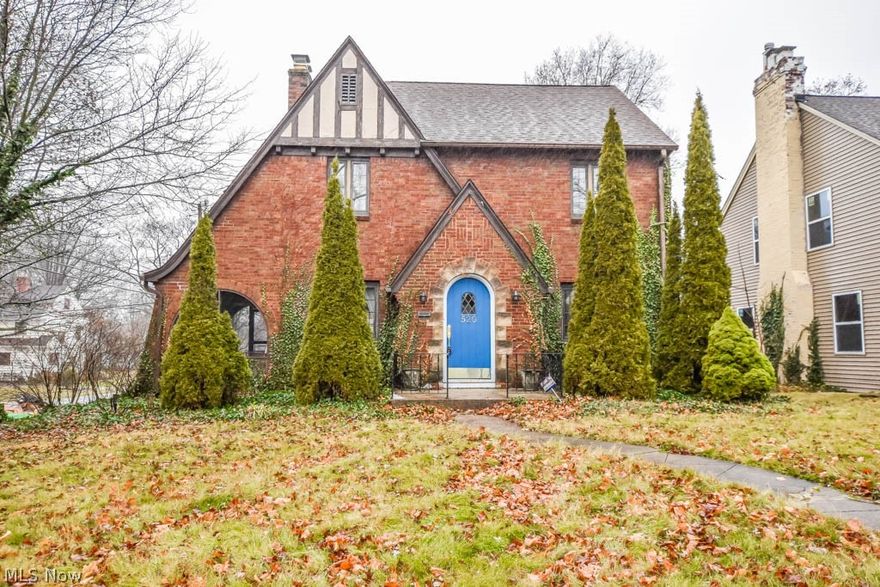 Modern design meets classic charm in this stunning brick Tudor! An arched front door that opens into the vestibule is the 1st hint of the character you'll find throughout this home. The living room boasts a gas fireplace, wide crown molding, refinished hardwood floors and access to the quaint screened-in side porch. You're sure to be impressed by the new dream kitchen complete with a farmhouse sink, an abundance of cabinet space, stainless steel appliances, open shelving and butcher block countertops! Host holiday gatherings and everyday meals in the dining room accented by raised panel molding and a crystal chandelier. A guest bath completes the main level.  Upstairs you'll find 3 wonderful bedrooms and a modern full bath with beautiful tile work and a vessel sink. The basement adds a partially finished rec room, plenty of room for storage plus a laundry area with a washer and dryer that will stay with the home.  Outside is equally as impressive with a fully fenced backyard with a fan