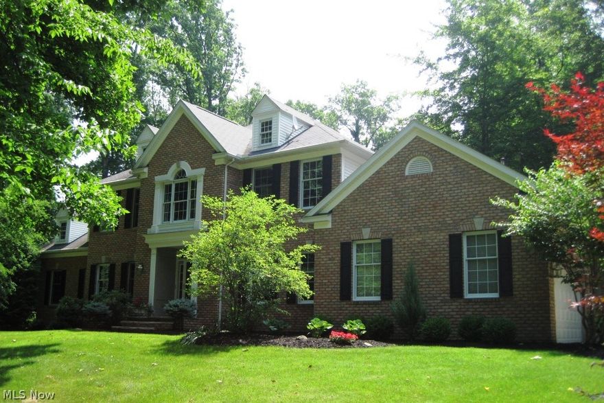 Regal, brick front colonial nestled on over 3 lusciously landscaped acres in Sharon Twp. Home boasts gracious 2 story foyer w/hrdwd, handsome FF library w/glass French doors, mantled frpl & custom built-ins, & spacious formal dining room. Gourmet kitchen offers granite counters, SS appliances, center island/brkft bar, dbl ovens, warming drawer, palladian windows, pantry, hrdwd flrs, & separate eating area w/access to deck. Vaulted great rm showcases floor to ceiling brick frpl & skylights. Bright & cheery sunroom w/panoramic views of tranquil backyard, skylights, & access to deck. Luxurious master suite features radiant heat floors, WIC & glamour bath w/dbl vanities, custom built-ins, soaking tub, & separate walk-in shower. 3 addtl, generous sized bdrms & 2 full baths complete the 2nd level. Sun film on sunroom & eating area windows.  Full basement.  Outdoor living is at its finest w/reconfigured deck, hot tub, patio w/stone walls & seating, pondless waterfall, firepit, & mult. sheds.