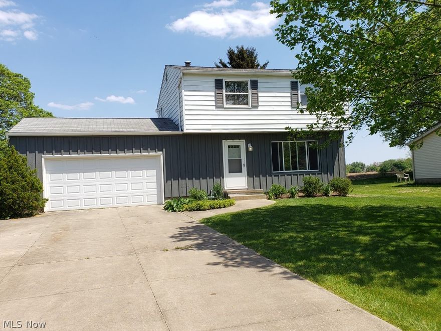 private backyard, that looks out over an eighty acre farmer’s field framed by woods, gives you a country setting within a neighborhood.  You can enjoy the view from the deck or the 12x20 three season porch. 

The house has only had one family and is located on a quiet street in Suffield.  What was once a four bedroom house has been converted to three bedrooms to give the master bedroom more space, including two large closets. 

The full basement and oversized 2 car garage, provide additional storage and living space.  There is also a pull down ladder from the attic.

The house is all gas and includes kitchen appliances and a clothes dryer.  It has a garbage disposal,  an extra-wide concrete driveway, as well as public sewer and water.   The living room has newer, high quality, woodgrain vinyl plank flooring. 

The windows tilt in for easy cleaning.