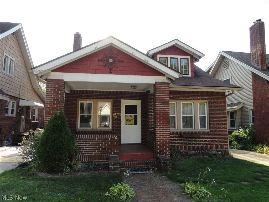 Charming brick bungalow with many desirable features. Welcoming front porch, formal living room and dining room with laminate floors. Built in cabinets & wood burning fireplace. Cute kitchen with Corian counters & updated floor. Updated bathroom beautifully done. Two bedrooms on first floor and huge bedroom on 3rd floor with 3 closets and a decorative fireplace. Hardwood floors in all bedrooms. Newer windows on 1st floor and new roof in 2005. Concrete driveway, fire pit, partially fenced semi private backyard.