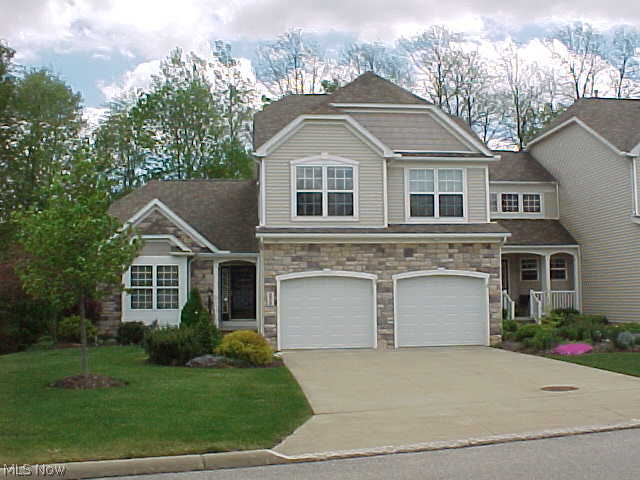Impeccably maintained "Cornwall" end unit built by Design Construction. Spacious 2 story with full walkout basement. Gorgeous private view of wooded lot from back deck and patio. Great Room/Dining with vaulted ceiling and fireplace. First floor Master Bedroom and Master Bath with double sinks, walk-in closet and jetted tub. Beautiful tiled eat-in oak kitchen. First level TV room/den with back view. 2nd floor features spacious loft/sitting area, 2 bedrooms, full bathroom, and walk-in storage closet. Walkout basement with over 700 square feet of finished space features family room, office/exercise room and full bathroom, refrigerator and pre-plumbing for bar/kitchen area. Additional features include full interior wall insulation, security system, solar fan in attic, first floor laundry room. Other room is 2nd floor storage room/closet. 1 year home warranty included.