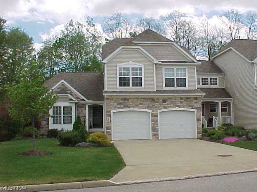 Impeccably maintained "Cornwall" end unit built by Design Construction. Spacious 2 story with full walkout basement. Gorgeous private view of wooded lot from back deck and patio. Great Room/Dining with vaulted ceiling and fireplace. First floor Master Bedroom and Master Bath with double sinks, walk-in closet and jetted tub. Beautiful tiled eat-in oak kitchen. First level TV room/den with back view. 2nd floor features spacious loft/sitting area, 2 bedrooms, full bathroom, and walk-in storage closet. Walkout basement with over 700 square feet of finished space features family room, office/exercise room and full bathroom, refrigerator and pre-plumbing for bar/kitchen area. Additional features include full interior wall insulation, security system, solar fan in attic, first floor laundry room. Other room is 2nd floor storage room/closet. 1 year home warranty included.