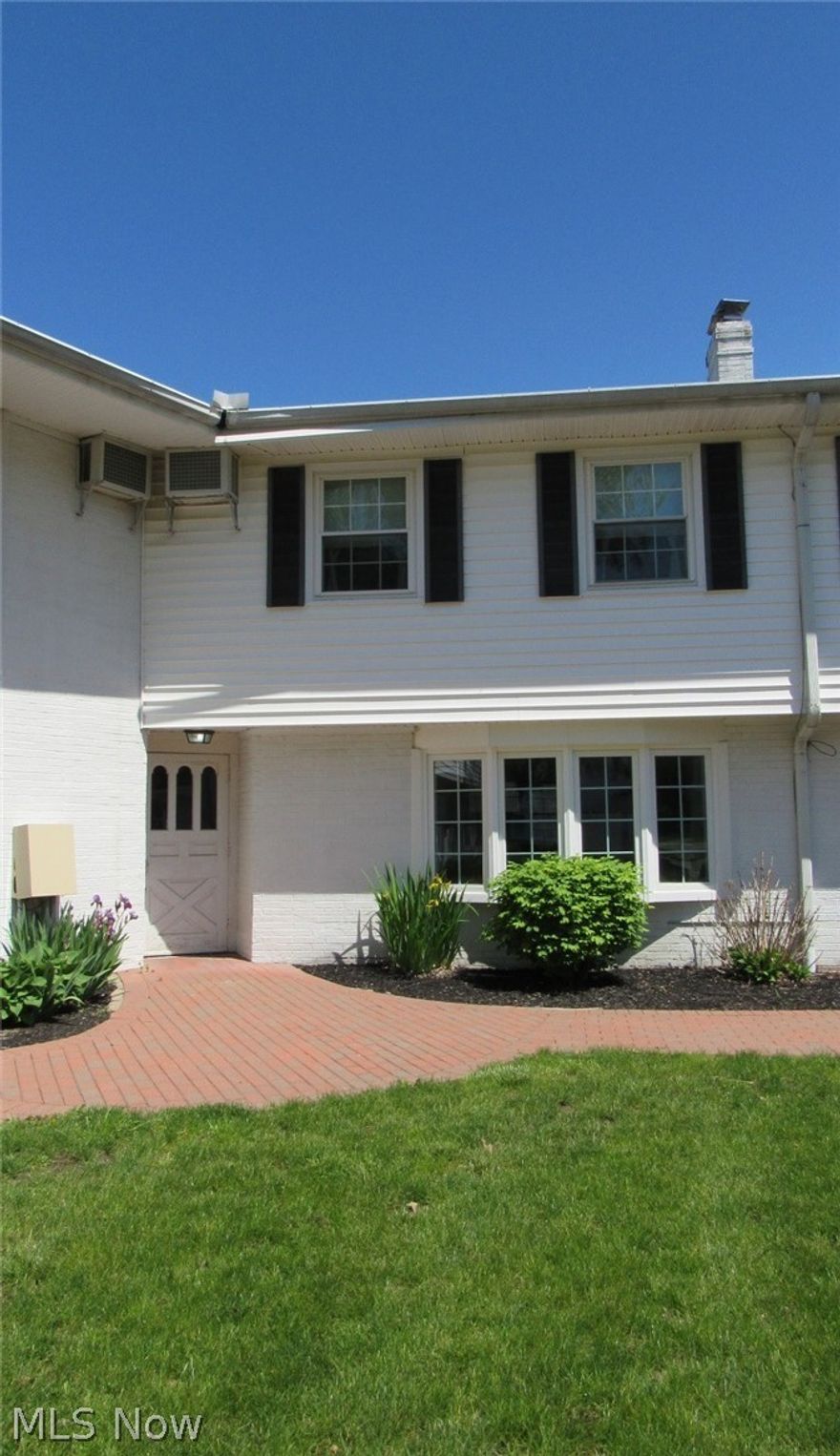 This updated spacious two story condo offers over 1700 square feet of living space, lots of storage space including the large, walk-in closet laundry area off the spacious master bedroom, a bonus room between the garage and kitchen with cabinets and access to the patio with newer vinyl fence for privacy, built ins in the living room that frame the fireplace, good closet space including a linen closet, an expansive attic and one bedroom with two closets. All appliances stay. The spacious full bath features double sinks . The heated garage was recently painted. Other updates include paint and flooring throughout, new toilet in master bath, new plumbing behind kitchen sink and in laundry room. Make this your home in time to enjoy the sidewalks throughout the community as well as a playground, picnic area and big pool. Convenient location close to all amenities with quick and easy access to the freeways. There are guest parking spots available on both sides of the building. Seller is selling AS-IS w/ no repairs.