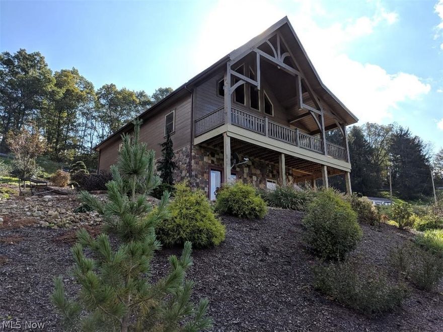 Beautiful Rustic Hideaway sitting on 7.5 secluded acres.  Close to Dover and interstate.  Built in 2014 this open concept home has a spectacular view from a huge wrap around deck and every window.  Fenced with 2 barns, waiting for you to bring your horses.  House and pavillion were built by Weaver Barns.  Home has a poured walkout basement which is semi finished and could possibly add an additional 2 bedrooms and a bath.