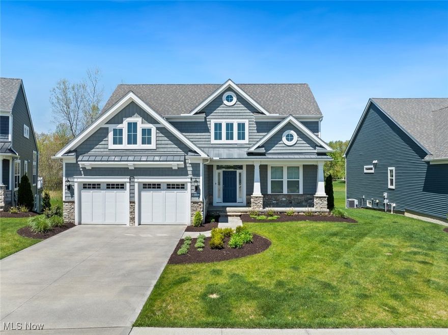 Welcome to Your Dream Home! This stunning luxury single-family home, located in The Harbour of Avon Lake, offers 4 bedrooms, 2 full baths, 2 half baths, and an attached 2-car garage. The charming Shaker-style siding and beautifully manicured landscaping provide exceptional curb appeal. Step inside to an impressive two-story foyer that opens into a vaulted Great Room featuring a cozy fireplace, wet bar, and an open-concept layout flooded with natural light. The kitchen is a true showstopper with crisp white cabinetry, a subway tile backsplash, granite countertops, a range hood, pendant lighting, pantry, and a center island with seating. A spacious dining area overlooks the deck, making entertaining a breeze. The first-floor primary suite boasts a luxurious ensuite with a double vanity, soaking tub, walk-in shower, and a his and hers walk-in closet. A private office off the foyer, main-floor laundry, and a convenient half bath complete the main level. Upstairs, you'll find a loft area and two generously sized bedrooms with ample closet space, sharing a well-appointed full bath. The finished garden basement expands your living space with a large rec room, a fourth bedroom with two large window, a half bath, and abundant storage. Step outside to enjoy the covered deck with steps down to a concrete patio — perfect for relaxing or entertaining. Take advantage of nearby walking trails that lead directly to Walker Road Park. Just 8 minutes from Crocker Park and 5 minutes from Lake Erie, this home offers the best of both comfort and convenience. Skip the hassle of building — enjoy a newer home that’s move-in ready. Call today to schedule your private tour!