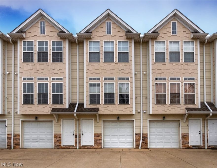 Welcome home to Market Square! This 2 bedroom 1.5 bath townhome has great style and design. The first floor boasts a one car attached garage and laundry room. Level two features a living room with new vinyl wood flooring and a wall of windows, kitchen with refrigerator, stove, and microwave, and a half bath. Retreat upstairs to the two bedrooms and a full bathroom. A great place to call home!