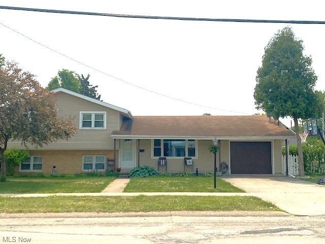 Location! Location! Location! This charming Split Level in the heart of Port Clinton offers 4 bedrooms, 2 full baths and ready to move in and enjoy the rest of the summer! Upon entrance, the front foyer houses a double closet and graciously opens up into a charming living room space with oversized front window and plenty of natural light! The open kitchen layout offers PLENTY of cabinets/storage, stainless steel double sink and stove, dishwasher/Fridge that stay, and a lovely attached dining area with double sliding doors overlooking the charming back deck and patio areas in the spacious fully fenced in backyard! The lower level offers a lovely full bathroom, a nice sized bedroom and a full recreation room! Upper level offers 3 more bedrooms and a full bathroom and plenty of storage space. 2 Car attached garage with front to back tandem spaces, laundry area, workshop area on the side and man door to back yard! Large paved driveway, cozy front porch area! 2 blocks from Lakeview Park! O
