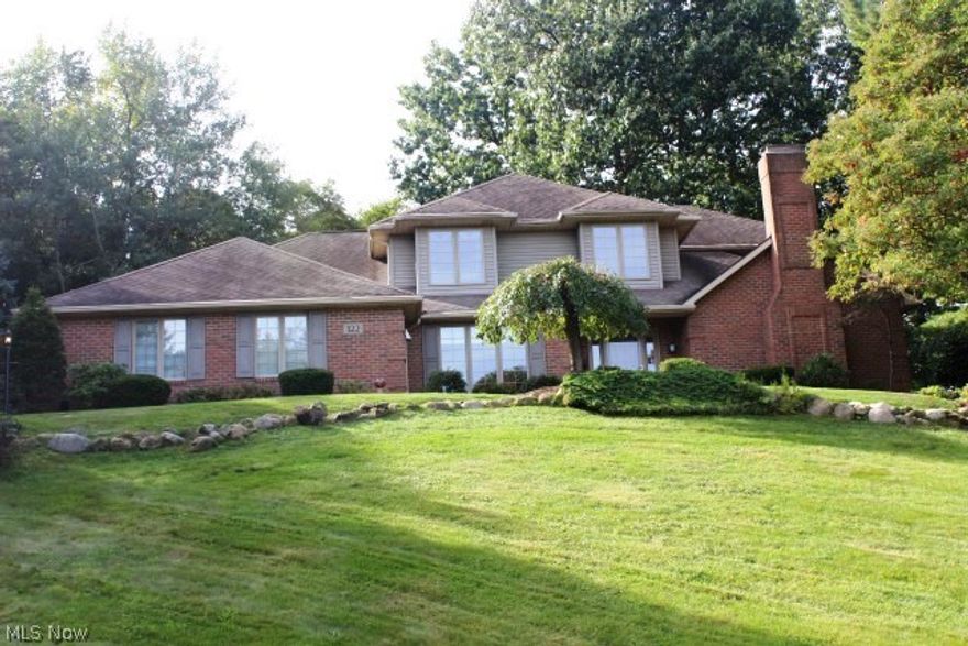Phenomenal home & location in Aldawood Hills with access to Portage Lakes* Soft contemporary brick with 3-4 bedrooms, 2.5 bath, 4 car side load garage  (heated driveway) & approx. 3428SF including lower level rec room* 2 story entry with turned staircase, plant ledge & wood floor* Office off foyer with crown* Formal dining with wood floor & slider to deck* Spacious kitchen with granite, stainless Maytag appliances (gas range, microwave refrig & dishwasher), pantry, tile backsplash, breakfast bar & wood floor* Bayed sunroom wrapped with windows & wood floor* Great room with built ins, wood or gas brick fireplace, window wall, wet bar, crown & access to deck* 1/2 bath with granite* 1st floor laundry* Lovely master with sitting area with access to balcony, walkin with builtins, master bath with jetted tub & double vanity* Bedroom #2 with slider to balcony* Guest bath with skylight* Heated 4 car with built in cabinets, work bench, storage (lift is negotiable)* Deck across back of home over