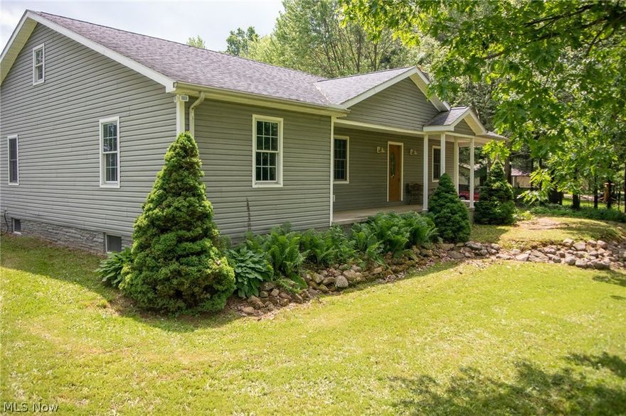 Welcome to your own private piece of paradise!  Situated on a scenic 2.5+ acre lot in the Southeast School district of Portage County, you won't find another home like this! The sprawling acreage starts with a tree-lined drive, where you will pass a deep (20') stocked pond complete with fish and turtles, then arrive at a gorgeous custom-built (2003) ranch home. This home was constructed with the highest quality standards - wood grain vinyl siding, foundation wrapped in Pennsylvania blue ledge stone, 30 year dimensional shingles, 12" block, 6" walls, high efficiency Temp Star 14 seer heat pump, and a Bronco wood furnace - plus a dedicated wood room w/chute.The floor plan features an open concept great room/dining/kitchen area, huge master suite with 9x11 walk-in closet, jetted garden tub, separate shower, and first floor laundry!  The front bedroom has it's own office or sitting area, could be converted to another bedroom if desired. Downstairs you'll find a huge 2200 SF 13 course natur