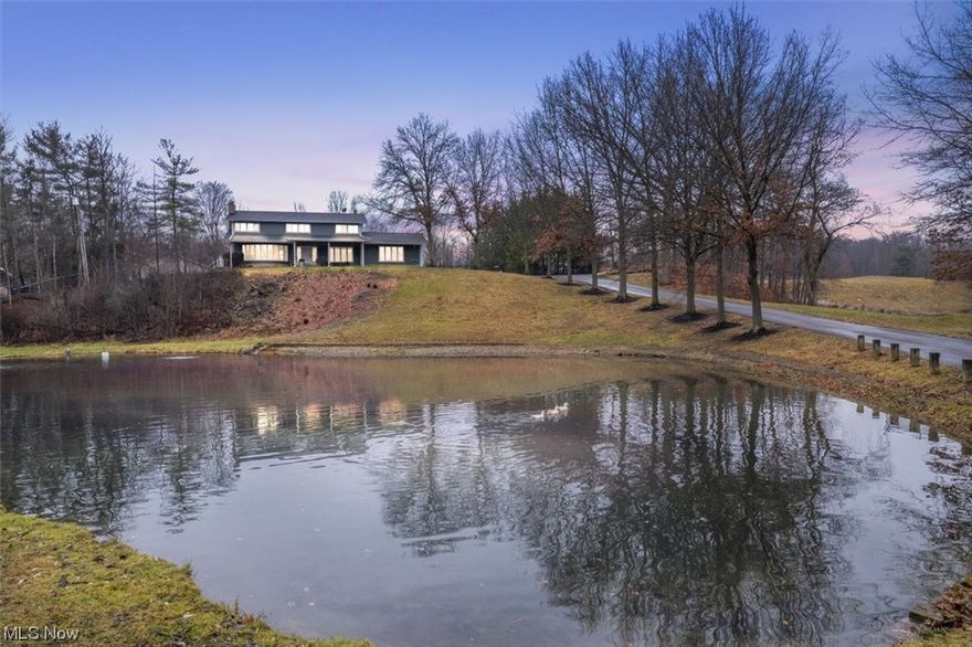 A true one-of-a-kind property that is nestled on over seven picturesque acres! A long winding driveway leads up to a splendid colonial showcasing a tropical oasis featuring a large in-ground pool, wooded trails ideal for ATVs, dirt bikes, and hunting and over 4,000 sq ft in a heated outbuilding. Meticulously maintained, this home has had many recent updates inside and out. The sprawling layout encompasses a large kitchen that offers a recently replaced refrigerator and dishwasher (2022) along with other
appliances that convey as well as six bedrooms, with five on the upper level (including the master bedroom with a fireplace) and an additional bedroom on the walk-out lower level. The lower level also has a spacious recreation room with new carpeting throughout (2021) that grants access to the lower-level deck with hot tub and outdoor fireplace. Four full bathrooms ensure convenience for all residents. The roof was expertly replaced in 2017, providing peace of mind for years to come. A new insulated
garage door (2023) enhances both energy efficiency and curb appeal. With a total living space exceeding 4,400 sq ft, this home seamlessly blends modern comforts with rural tranquility. Entertain guests on the Trex deck, added in 2017, or retreat to the cabana by the pool, a recent addition in 2023. The 30x60 in-ground pool has depths ranging from 3.5 feet to twelve feet, perfect for the slide and new diving board (2023). A new pool heater was installed in 2022. The 32x130 outbuilding is a car enthusiast’s dream, providing space for up to 12 vehicles and equipped with water, heat, and electricity. The landscaping is a harmonious blend of nature and design, with a pond stocked for fishing that hosts three ducks as well as a fenced-in chicken coop, converted from a shed in 2021, where eight chickens roam. Immerse yourself in the luxury of country living while being within a few miles of stores and restaurants!