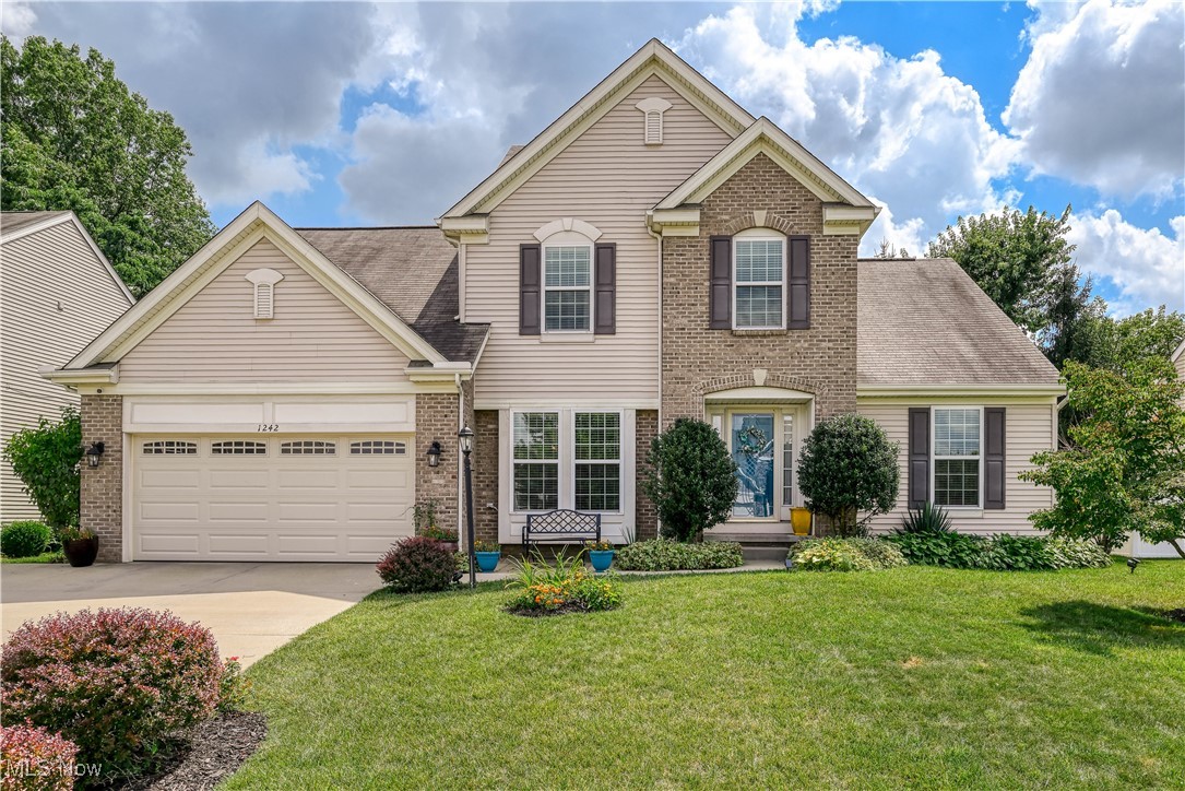 Welcome to 1242 Bexley Circle. The spacious 4 Bedroom, 3.5 Bathroom, 2 story Traditional home, located in the city of Green's Hyde Park Community on a quiet cul-de-sac, is a must see!!! Location is superb, landing you close to shopping, restaurants, gas stations, drugstores and interstate 77. This home features a primary bedroom on the first floor with lighted tray ceiling, a primary bathroom that has granite top double sinks, soaker tub, separate walk-in shower, and a large walk-in closet. The second primary bedroom is on the second floor, connected to a full bathroom, and also has a large walk-in closet. The first floor has floor to ceiling windows. The living area offers an open floor concept, with custom built-ins, a gas fireplace with electric blower to keep you warm on those cold Ohio days. Kitchen has new granite countertops, new back splash, and comes equipped with stainless steel refrigerator, range, dishwasher and built in microwave. The formal dining room has a tray ceiling with lots of natural lighting and a beautiful view. Off the formal dining room is a large walk-in pantry and beverage bar with wine cooler. Laundry and 1/2 bath are on the main level. Partial, mostly finished basement comes with a full bathroom, and storage galore. Back yard has an 8x10 shed, and a stamped concrete patio with a freshly painted pergola. There have been many updates since home was built in 2009. All new windows in rear of home (2023) with easy access for cleaning, granite in kitchen and bathrooms, primary bathroom has been completely updated, recently painted throughout, new white carpet throughout, new gas stove, new electric hot water tank (heats faster than gas), new garage doors with opener for tandem size garage and ADT Home Security System. This custom-built home is the only one of its kind in the Hyde Park Community, has only had one set of owners, and is absolutely turnkey ready!!!