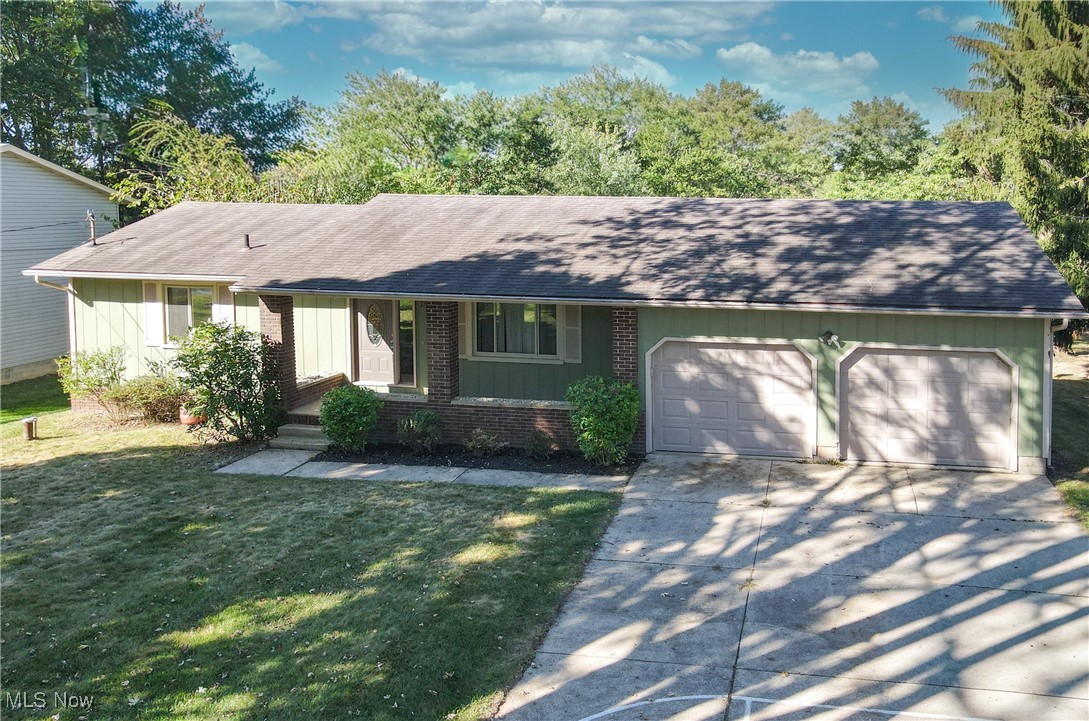 Charming Ranch Home in Tallmadge Local Schools This lovely home features two spacious bedrooms on the main floor, plus an additional room in the basement that can serve as a third bedroom or a cozy office space. As you pull up, you’ll immediately notice the charming character of the home, highlighted by the inviting covered front porch—a perfect spot to relax with a morning coffee. Step through the front door and into the generous living room, which seamlessly flows into the dining area, creating an open and airy atmosphere. Adjacent to the dining area is the well-appointed kitchen. Just off the kitchen, you’ll find a delightful screened-in porch that overlooks the backyard, offering a tranquil space for outdoor enjoyment. Step outside onto the large deck, perfect for entertaining or soaking up the sunshine. Down the hall from the living and dining areas, you'll discover a full bathroom and the two comfortable bedrooms, providing convenient single-level living. Venture down the stairs to the finished basement, where you’ll find an additional room previously used as a bedroom, but easily convertible to an office or guest room. The basement also features another full bathroom and a spacious finished living room. Plus, the utility room includes a laundry space for added convenience. This home comes complete with a two-car attached garage, providing ample storage and parking. The exterior spigots are hooked to the well but the rest of the home is public water. Recent updates include a new furnace and A/C (2023), gutter covers (2019), glide-out lower kitchen cabinets (2020), a double oven range (2021), a 7-foot privacy fence (2022), and window tinting on the west-facing window (2020). With so much to offer, this charming ranch is a must-see! Call today to schedule your private tour!