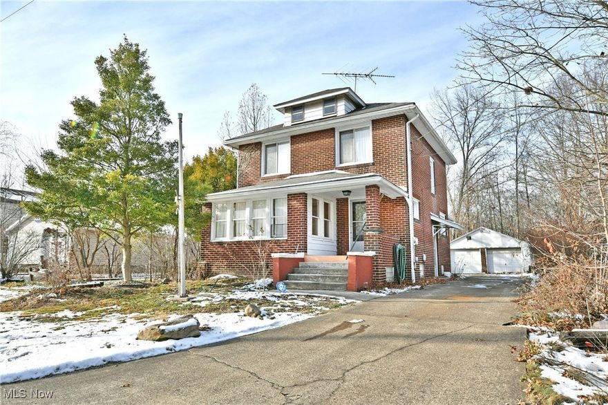 Take advantage of this multiple lot property, showcasing an impressive, all-brick 2-story residence along with multiple outbuildings to include a prominent storage shed and detached, two-car garage. The sizeable yard delights with personalized landscaping touches, a pergola-topped garden, and plenty of room to enjoy the outdoors. A cement driveway extends from the road as you walk up the stairs to the covered front porch. Inside, two floors of move-in-ready living space await. The foyer introduces a carpeted staircase trimmed in rich, dark-stained woodwork. Nearby, the naturally lit living room enjoys an abundance of sunshine courtesy of the window-lined front sunroom, an ideal all-season parlor for relaxing. Meanwhile, the colorfully appointed formal dining room is found just steps from a centrally based kitchen and casual dining space, adorned with warm wood paneling and a tiled backsplash that divides the rows of cabinetry. Upstairs, a trio of spacious bedrooms eagerly draws you near with bright and inviting surroundings, marked with tall windows and carpeted flooring. A full bath and additional hallway storage complete the second level. The basement brings added value with laundry services, workshop space, and even more storage options.