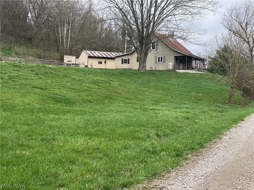 Find your peace with this charming home situated on just over 5 acres. Home has 3 bedrooms and 1 bath, with an open concept from the living room to the kitchen. Detached 2 car garage and also a stable for small livestock. Just minutes from Blue Rock State Park, this home is a must see!