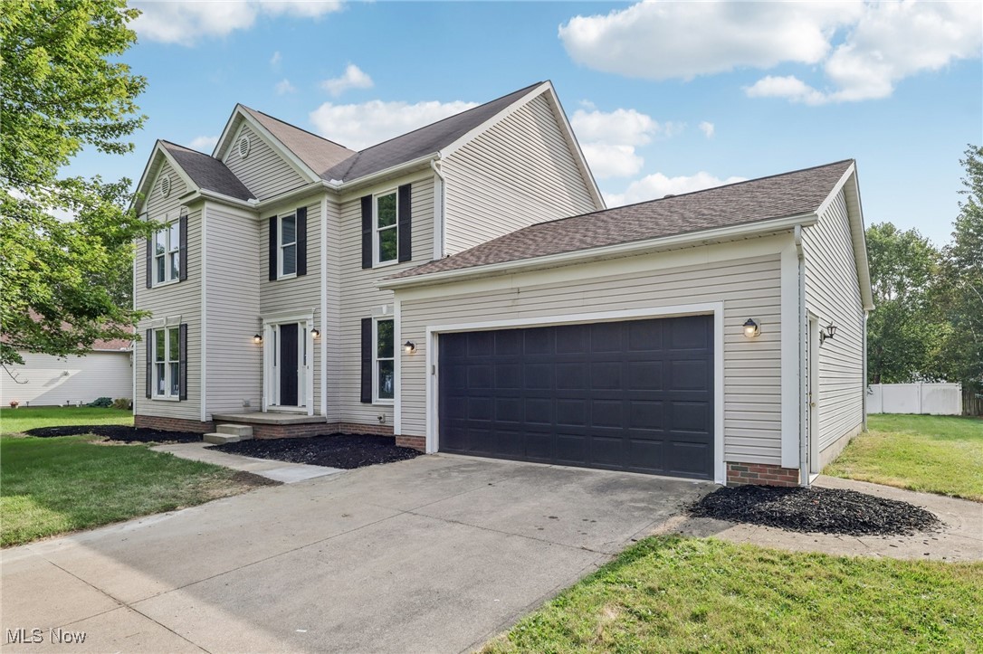 Welcome to this beautiful 4 bedroom, 2.5 bath colonial in Medina! The inviting floor plan features updated flooring and neutral finishes throughout, highlighted by a spacious room with a stunning stone fireplace. The kitchen is designed for both style and function with granite counters, stainless steel appliances, and ample cabinetry. Upstairs, the primary suite offers vaulted ceilings, a walk-in closet, and an ensuite bath complete with double sinks, a soaking tub, and a separate shower. Three additional bedrooms provide plenty of space. The unfinished basement offers excellent potential for future expansion or storage, while the 2-car garage adds convenience. Enjoy outdoor living on the deck overlooking the backyard. With its thoughtful updates and prime location, this home is move-in ready and waiting for you!. Included 100-Day Home Warranty with buyer activation