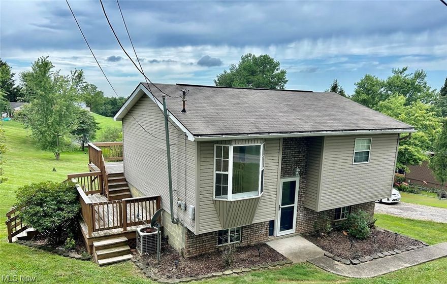 New to the market is this well maintained, move in ready bi-level home in Warren School District on a 3/4 acre corner lot!  This 3 bedroom, one bath home has been freshly updated with interior paint, new entry handrail and crown molding in master bedroom.  The kitchen has access to the rear tired deck.  The dining room has a pretty bay window and ceiling fan.  The lower level is mostly finished with a huge living room, fireplace, walk out to the back yard and 3rd bedroom that could be used as an office.  The laundry room is conveniently located on the main level.  Immediate Possession.  Schedule your appointment to see this beauty right away!