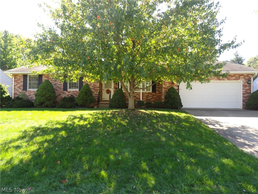 Beautiful brick ranch in excellent condition. Original owners lovingly maintained this home since 1964! Elegant living room with crown molding and chair rails, gas fireplace with lovely mantle and big picture window. Cheerful kitchen with original hard rock maple cabinets in beautiful condition. Stainless refrigerator, counter top range & newer oven. Dining area with gas fireplace, bay window and door to 14 x 8 covered patio overlooking brick patio and lovely private backyard. 25 x 15 rec room with wood burning stove and built in cabinets, work room plus 2nd full bath. New furnace! Many new windows & doors. 2 car attached garage with pull down access to attic.