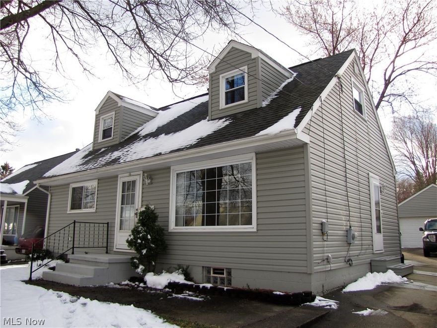 This charming 4 Bedroom Cape in Ellet has much more room than it looks! The bright Living Room has a large picture window and hardwood floors under the carpeting. The Eat-In-Kitchen has newer appliances and a sunny eating area overlooking the back yard. The two First Floor Bedrooms have large closets and beautiful hardwood floors, as does the hall. There is a Full Bathroom on the first floor. Upstairs are two large Bedrooms with Full Dormers and Closets for ample storage. A finished stairway with recessed lighting leads to the lower level where there is a Recreation Room with a bar and a separate office or project room - each with recessed lighting. The large Laundry/Utility Room has the Washer, Dryer, Laundry Sink and a shower. There is a newer detached Two Car Garage with attic storage. The fenced-in back yard has a patio as well as a brick barbeque. Improvements and updates include the roof and vinyl siding 2013; replacement windows 2011; High Efficiency Gas Furnace 2007; A/C 2008;