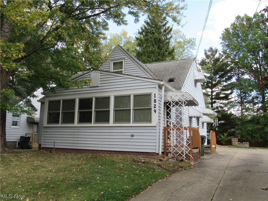 Don't miss this well maintained 3 bedroom Cape Cod with many extras!  The quaint eat-in kitchen has built-in cabinetry, pantry, neutral flooring, a lovely garden window, and all of the appliances are included!  Living room boasts a custom stone wall.  The enclosed front porch features custom windows (2016) with blinds inside them.  1st floor master bedroom has a custom, built-in wall of storage as well as a smaller closet.  There's a second first floor bedroom, linen closet, and full bathroom with walk-in shower (2020).  Chair lift is available to access the upstairs spacious third bedroom with sitting area & many storage options!  This lower level was made for entertaining!  Enjoy the finished family room with custom built-ins, knotty pine paneling, electric fireplace, full bar with wet bar, bar stools & storage!  Lower level laundry area has washer, dryer, two freezers, refrigerator, gas stove & half bath area all included for you to enjoy!  There are also glass block windows, (2014) hot water tank, (2020) furnace and a/c.  There's TWO 2 car garages, and an enclosed rear patio area on this partially fenced-in spacious yard. (One garage was previously used as a workshop.)   This home is more spacious than it appears & ready for your decorating touches to make it yours!  (Original hardwood floors under the carpeting & on second floor)