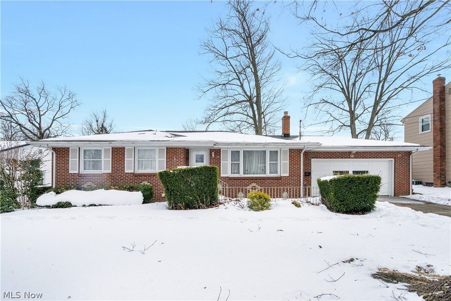 A charming 3 bed 2 bath brick ranch in Austintown, offered by the original owners is a rare find! This home is a true time capsule, waiting for your personal touch! Discover hardwood floors, preserved under the vintage carpet on the main floor. The finished basement is perfect for gatherings, featuring a kitchenette, bar area, and workshop. This home is well-loved and taken care of in its original state. Bring your vision and make it your own! 1-year home warranty provided for peace of mind!