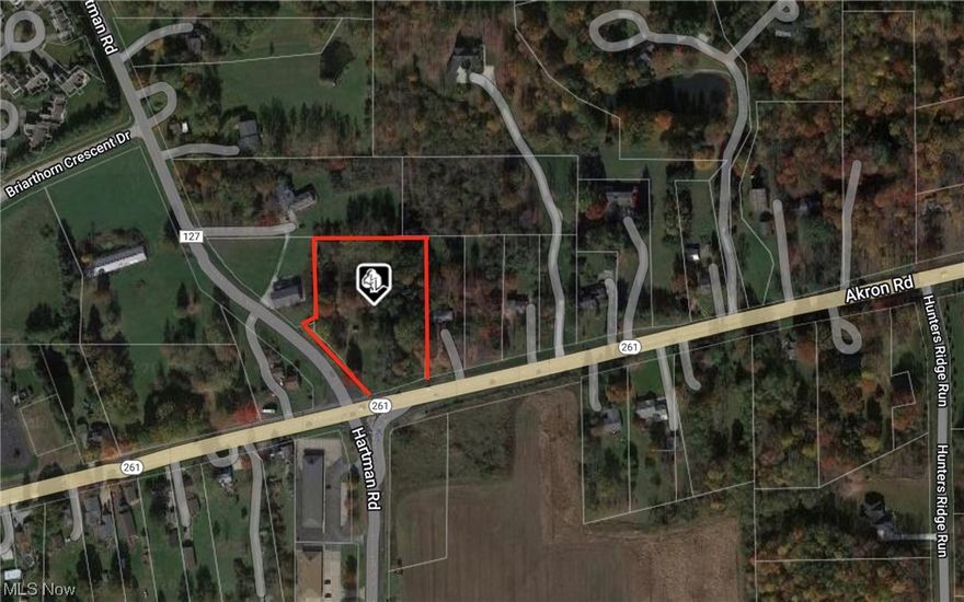 This is a large 2+ acre lot on a corner commercial busy intersection with traffic, light many many possibilities.