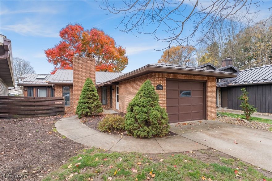 Welcome to this beautifully maintained 3-bedroom cluster home, combining first-floor convenience with modern upgrades. Skylights fill the main living areas with natural light, while the primary suite boasts a sliding glass door to the 4-season sunroom, creating a private retreat.

Relax in the great room with a cozy gas fireplace, perfect for year-round comfort. Two main-floor bedrooms provide ease of living, and the finished walkout basement adds a third bedroom, full bath, and versatile family/recreation room.

Additional highlights include a brand-new metal roof installed in 2025, a private patio, community pool, and low-maintenance lifestyle with lawn care and snow removal included. Conveniently located near shopping, dining, parks, and highways, this home combines light, space, and lifestyle in one perfect package.