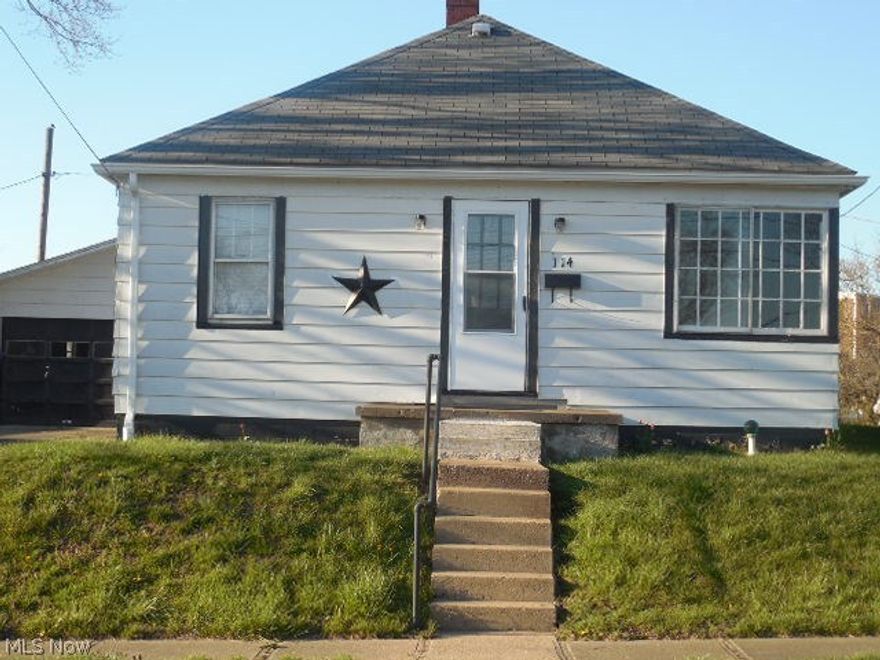 This is a 2 bedroom home with a large 2 car detached garage on almost a 1/3 of an acre lot close to downtown.  It features a living room, kitchen, dining room and a full bathroom.  There is a full basement perfect for storage.  This would be a great investment opportunity or someone looking for a smaller home.  Call today for a private showing