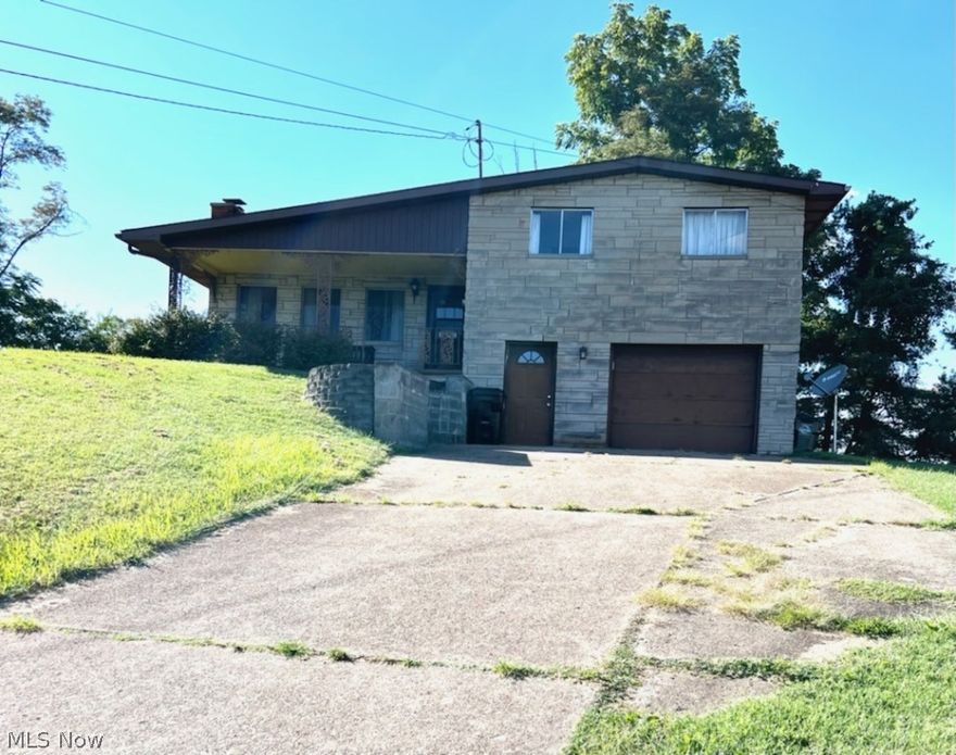 Great opportunity! Lovely home with large lot, nice views, oversized garage and newer furnace (2015) needs some TLC