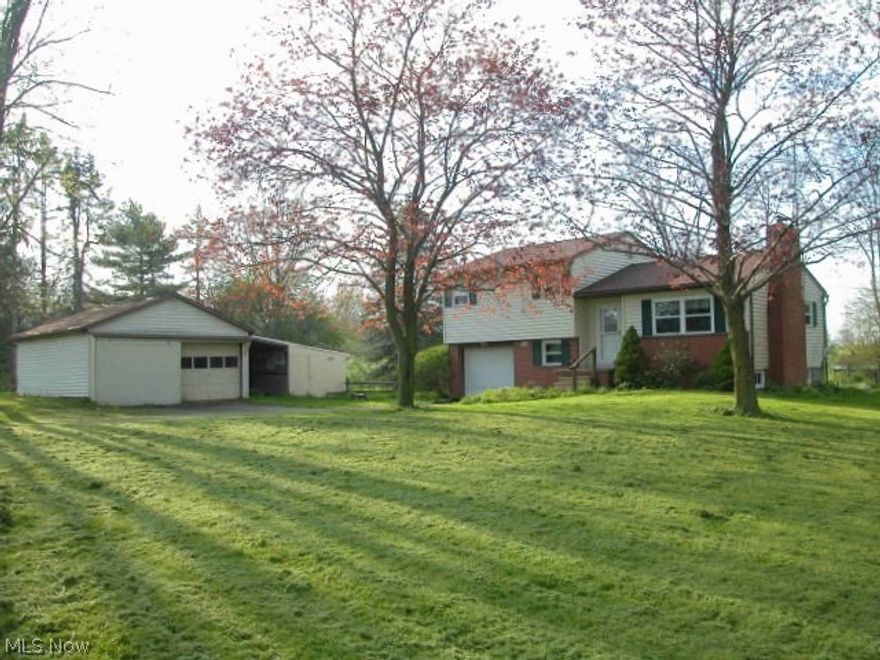 Great country property within minutes of Wooster.   Already set up for horses, great for other livestock and 4-H projects. Fenced pasture, barn, bridge over small creek. Attached 1 car garage and detached garages w/barn and shed for plenty of storage. 4 level split has open kitchen and dining room. Woodburning fireplace in living room, finished lower level w/large family room, computer/office area and wood burner.  Nice two-tiered wood deck off dining room overlooking Koi pond w/waterfalls and country views and landscaped to the sides along property line for added privacy.