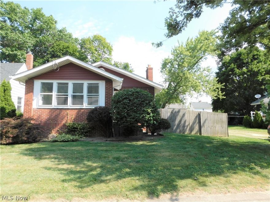 All brick ranch home just minutes from beautiful downtown Cuyahoga Falls shopping/restaurant area and close to Rt 8!  Perfect for first time buyer or investor!  Spacious living room w/wood burning fireplace, formal dining area and kitchen w/appliances that stay with house!  All new carpeting and fresh paint throughout!  Two good sized bedrooms and a full bathroom PLUS an extra area off the master that can be used as an office,  sitting room or for play/hobbies.  Full unfinished basement, a/c and furnace replaced in 2007; hot water tank 2019.  Completely fenced in backyard w/shed AND detached garage.  Schedule your private showing today before this one is gone!!