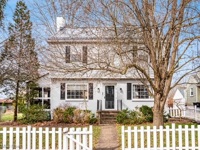Outstanding North End two-story home on a beautiful, private lot with mature trees and a charming picket fence, located on a quiet street. This spacious family home is close to everything and features gorgeous hardwood floors, a large living room with a fireplace, and an updated kitchen and bath. The massive master bedroom is complemented by two additional bedrooms on the second floor and a large living space in the finished attic that could serve as a fourth bedroom. With 2.5 baths, including a half bath in the basement, this home is both comfortable and functional. The property boasts a new metal roof installed in 2023 on both the home and outbuildings, as well as new gutters and downspouts. Enjoy the cozy screened porch with a vaulted ceiling that leads to a large deck and a well-manicured backyard with a fantastic playground—perfect for entertaining large groups. The location is incredibly convenient, just a three-minute drive to Walmart and a five-minute drive to all the North End conveniences, including Kroger, Home Depot, downtown, and I-70. It's also a ten-minute walk to Zanesville’s most beautiful park, Mission Oaks, and the Linden Ave. entertainment district. This is a move in ready home and all kitchen appliances stay. With two installed water heaters, you'll never run out of hot water, even with a large family. Parking is convenient with a 2-car detached garage in the rear off a freshly paved alley, room for 5 cars in the back, and two more spaces with front, off-street parking. All of this comes with the convenience of public utilities. This home won't last long!