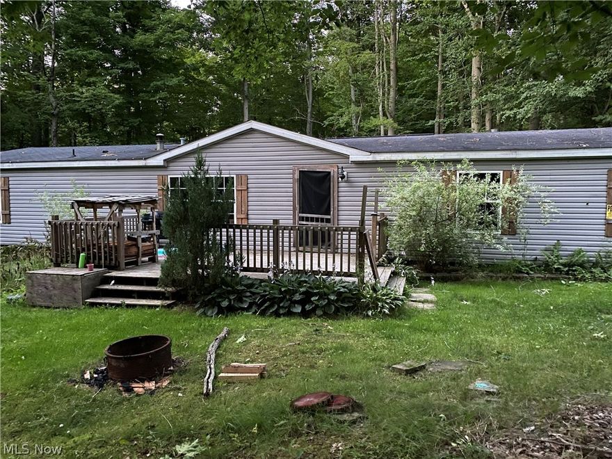 Private wooded setting on a secondary road. 2.37 acre lot that is mostly wooded. Very spacious manufactured three bed two bath home. Full unfinished basement with outside entrance.