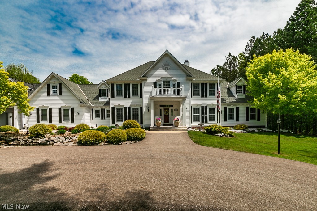 Welcome to this wonderful former builder model in the prestigious Reserve of Bass Lake, Munson Township. Fabulous mature landscaping w/ pond & waterfall & the circular drive lead up to custom stone steps & the grand entrance. LVT floors throughout the 1st level, custom decor in the formal DR w/ tray ceiling & vaulted Great RM w/ soaring mantel & fireplace. The gourmet kitchen is beautiful w/ white cabinetry, black granite counters, stainless appliances & 2 breakfast bars, opening to the vaulted morning room w/ window seats. fireplace & opening to fenced yard & pool area. The fabulous Master suite has gleaming wood flrs thru the glamour bath w/ double vanities, soaking tub, walkin closet & shower. An office, Living Room area, laundry, mudroom & half bath complete the 1st floor. Upstairs, there are 3 BDRMS, 1 w/ its own full bath, the other 2 share a Jack & Jill bath. There is access to a huge attic space off this bath.The lower level is finished with a media room, kitchen area, rec room & exercise area. The outdoor area presents a restful retreat w/ an inground pool, beautiful landscaping & gazebo.Climate controlled Garage space for 6 cars w/ built in storage & access from detached to attached garage which could be finished & a storage shed The property is located on a private lot surrounded by nature. Close to all the historic Chardon Square area has to offer in dining, shopping & access to major highways. Come home to this serene setting, still close to all amenities!