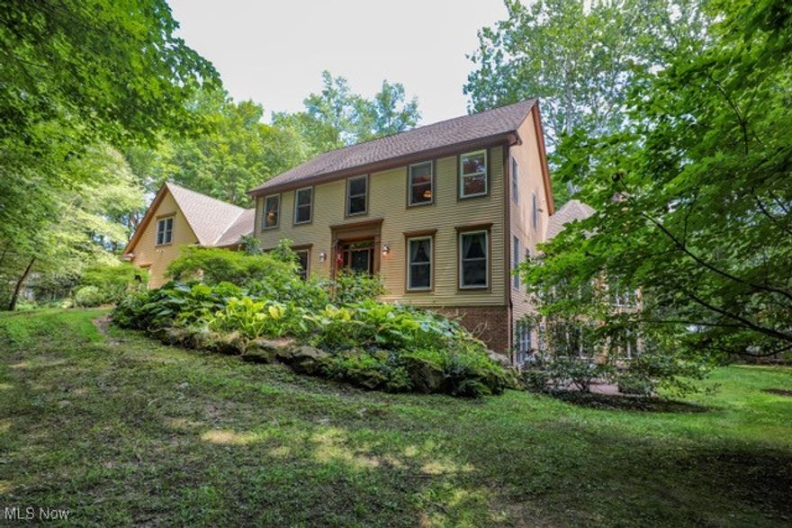 A private estate where elegance meets comfort. Set on 3.66 beautifully wooded acres, this distinguished residence offers exceptional privacy and refined living just minutes from Aurora's finest amenities. Inside, discover five spacious bedrooms, each with its own en-suite bath, including two primary suites thoughtfully placed for both convenience and retreat. A grand two-story foyer with a chandelier sets the tone, leading to a formal living and dining rooms with rich millwork, tray ceilings and timeless crown molding. The heart of the home is the gourmet kitchen, designed for both daily living and entertaining. Granite counters, a center island, double ovens, and an adjoining dining area open seamlessly into the family room and sun-filled octagonal sunroom with fireplace. The walk-out lower level extends the living space with a striking wood-clad library and fireplace, an additional primary suite, and access to a landscaped stone patio. Outdoor living continues with a full-length composite deck overlooking your private wooded setting. Additional features include a 3-car garage with electric openers, dual furnaces and water heaters, abundant storage and a long paved drive ensuring seclusion and approach. Your Aurora sanctuary awaits. Schedule your private showing today. Please click virtual tour link.