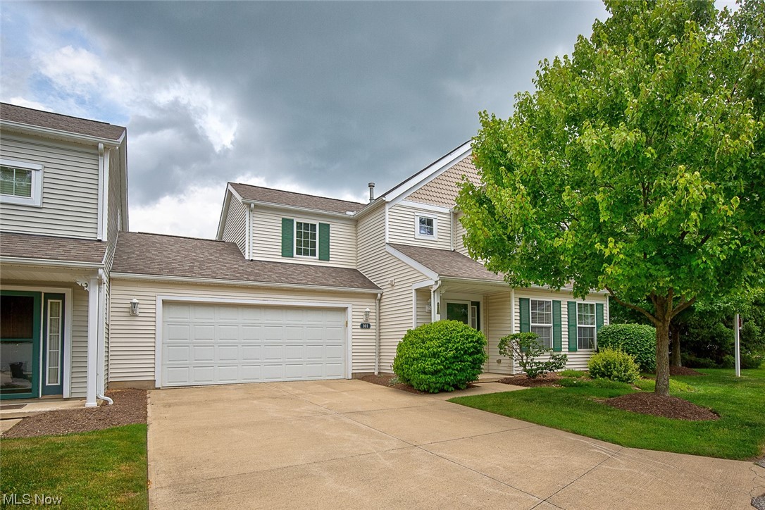 Welcome home to 101 Mallard Point, a gorgeous move-in ready 3 bedroom, 2.5 bath home with pond views! When you pull in, you will love this end unit featuring beautiful landscaping, over sized 2 car garage (only wall that connects to the neighboring unit), and quaint front porch. Step inside and fall in love with the clean, well-maintained living room that opens up into a large dining space and fully applianced kitchen. A slider will lead you out to your maintenance free deck overlooking a lovely pond with fountain feature. Great way to unwind and relax after a day of work! A half bath, first floor laundry, attached garage access, plenty of storage space and newer LVT flooring complete this first floor. Upstairs you will find the master suite with vaulted ceilings, natural light pouring in from each window, fall bath and an abundance of closet space. Two additional bedrooms and a full bath complete this upper level. Close proximity to Portage Lakes, shopping and highway access. This is