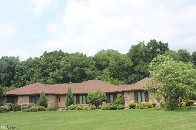 A phenomenal solid brick ranch on private 1.5 acres w/3298SF (main level only), 3 bedrooms, 3.5 bath, 25x27 attached garage & greenhouse* Sunk in living room* Formal dining* Family room w/wood burning fireplace, built in shelves, wet bar with refrig & w/slider to vaulted 4 season sun room w/heated floor & sky lights* Custom Schrock kitchen cabinets from Walnut Creek, granite, stainless kitchen appliances, pantry & breakfast room* Master bedroom with huge walk in closet with built ins includes shoe closet, his & her bathrooms, jetted tub & sky light* Bedrooms 2&3 with Jack & Jill bath* Back entrance with 1/2 bath* Vaulted potting room (could be 1st floor master) with brick floor, sky lights & slider to heated 13x26 greenhouse* Note- separate boiler heats greenhouse & 4 season sun room floor* Oversized garage can hold 3 cars* Shingles (single layer) 2000* Pressure tank 2009 & Marvin windows 2005* Patio* Fire pit* Electrical box 2010* Rod iron fenced flower & vegetable garden* Storage bar