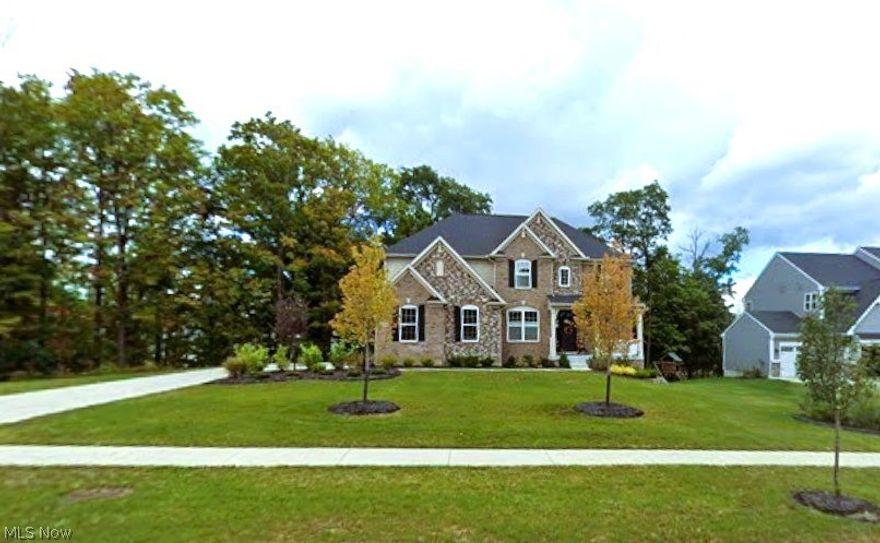 ?? Not all newer construction lives like this—don’t miss what sets this home apart. Custom Drees Buchanan in Meadowview Subdivision where thoughtful design and upgraded finishes create a home that stands apart from typical newer construction.
At the center of the home is a kitchen built for both everyday living and entertaining, featuring an extended granite surface overlooking the backyard, a large island with prep sink, and a high-end appliance package including a 48-inch Sub-Zero refrigerator, Wolf microwave drawer, Thermador dishwasher, six-burner gas range with pot filler, and upgraded double ovens. Storage was carefully planned with a baker’s pantry, an 11’ x 4’ walk-in pantry, and a butler’s pantry connecting to the dining space. Cabinetry includes soft-close features and pull-out shelving throughout.
The great room offers impressive scale with 19-foot ceilings, expansive windows, and a gas fireplace that anchors the space. The main level also includes a private office, dining room, casual eating area, and sunroom, creating flexibility for both work and gathering.
Upstairs, three spacious bedrooms each include walk-in closets, along with a loft that can easily function as a fourth bedroom. The owner’s suite features a large private bath with a walk-in shower designed for multiple users and a generous closet.
The walk-out lower level is ready for future finishing, already roughed in for a full bath and offering potential for additional living space, entertaining, or guest accommodations.
Located in Meadowview, this home offers access to nearby parks, convenient routes to downtown Cleveland, and proximity to Hopkins International Airport—making it a strong option for buyers seeking both quality and location.