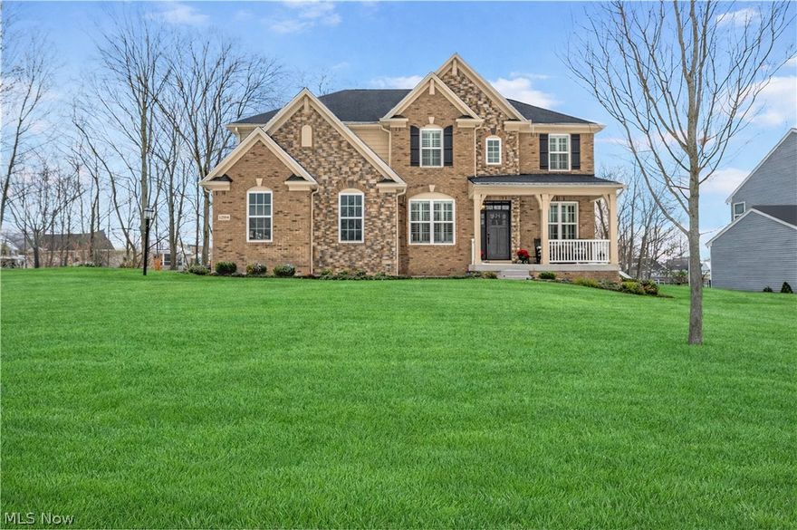 Crafted for those who recognize quality at a glance, this custom home exceeds expectations in every dimension. 12554 Meadowview Drive is a Drees Buchanan residence elevated far beyond builder standards—offering architectural presence, exceptional finishes, and flexible space in North Royalton’s premier Meadowview Subdivision.
The kitchen is the true centerpiece, designed for serious cooking and hosting. Features include an extended granite surface island, magnificent views of the rear-yard, professional-grade appliance package with Thermador dishwasher, six-burner gas range with pot filler, upgraded double oven with expanded racking, Wolf microwave drawer, and a 48-inch Sub-Zero refrigerator. Storage is unmatched with a baker’s pantry, an 11’ x 4’ walk-in pantry, plus a butler pantry connecting to the dining space. Cabinetry includes premium materials, pull-out shelving, and soft-close functionality throughout. A substantial island with prep sink anchors the layout.
The great room rises to 19-foot ceilings, wrapped in full-height windows and centered by an oversized gas fireplace—creating a dramatic yet inviting gathering space. The main level also includes a dedicated office, formal dining area, casual eating space, and sunroom, offering flexibility for both everyday living and entertaining.
Upstairs, three generously sized bedrooms each feature walk-in closets. The loft includes a closet and can easily convert to a fourth bedroom if desired. The owner’s retreat is expansive, with a spa-inspired bath showcasing a six-person walk-in shower and a large custom closet.
The walk-out lower level is unfinished and ready for your vision—already plumbed for a full bath and ideal for future entertaining space, additional offices, or guest accommodations. Leaf fitter gutter guards.
A standout opportunity for buyers seeking quality, intention, and presence in one of North Royalton’s premier neighborhoods.