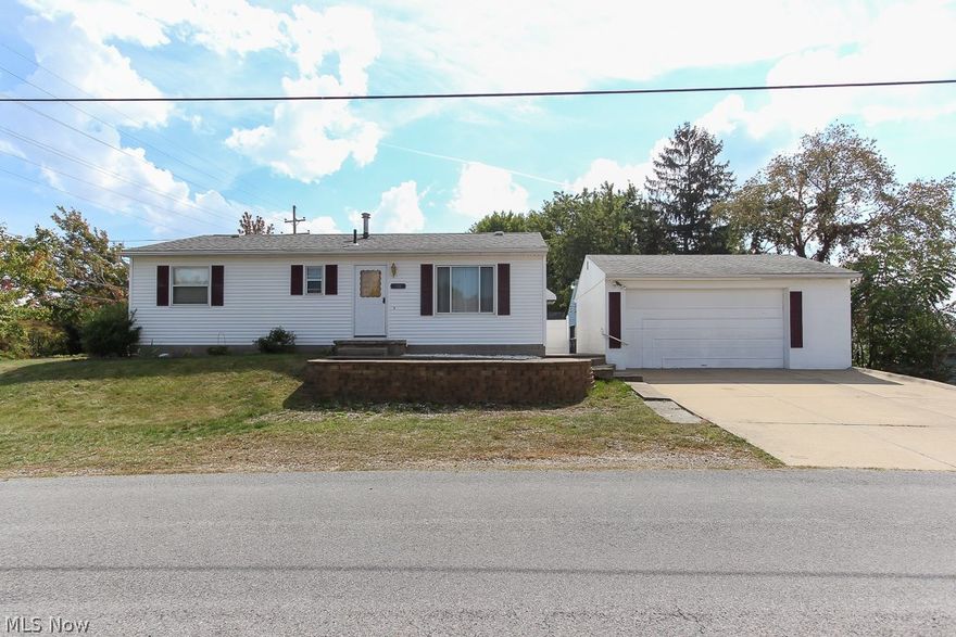 Wow! Only one owner the past 33 years! Located in Firestone Park, this home is close to shopping and restaurants, the parks, and downtown Akron with easy access to the major highway. Lots of storage capacity with a 2 1/2 car garage with full overhead attic and additional shelving. New carpet and neutral paint colors throughout the living room and all 3 bedrooms as of Spring 2017. The bedroom closets offer exceptional space. Clean, full basement with potential for finished living area with added glass block windows. Backyard features a sizable patio to entertain yet offers privacy with vinyl fencing. All of the major items have been taken care of including newer roof and siding 2010, furnace 2011, updated bath vanity and commode 2013, hot water tank 2014, electric panel 2014, and added central air in 2016. Come make this "home" today!