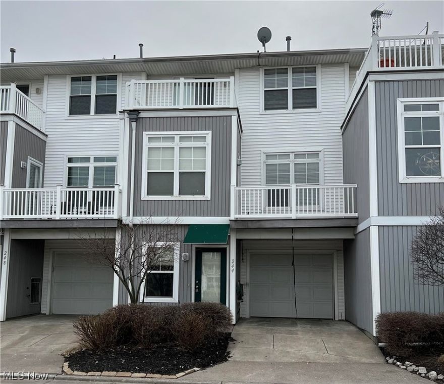 Move-in ready! This beautifully-maintained and freshly painted townhouse features gorgeous hardwood flooring, eat-in kitchen with tile flooring, large living room with fireplace, two generous-sized bedrooms, 2.5 bathrooms, and is located in Harbor Walk overlooking the Marina off of the Black River!  There is a nice-sized kitchen which is open to the living room and leads to the balcony overlooking the Marina. The community center features an in-ground pool and work-out facility.  Whether you're a boat-owner looking for easy access to the water and all that Black River and Lake Erie have to offer or someone who loves a water view and beautiful sunsets, this place is perfect for you! Located just minutes from downtown Lorain and Lake Erie, this is your chance to enjoy the good life by the water. Take a short walk down to the coffee shop, Shipyards restaurant, Community Center for a workout or to just take a dip in the pool to relax. The good life is waiting for you here! Washer/Dryer is