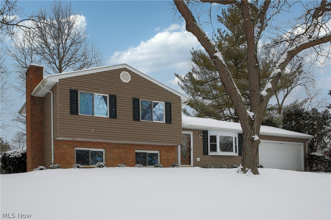 Located in the Wyoga Lake Community this four level split home has been well cared for. Beautiful curb appeal w/ updated exterior! Entering in the front door you’ll see the living room has an eye catching vaulted ceiling w/ wood planking & ample sitting room for guests. Transcending from the living room into the dining room & kitchen area’s you’ll notice it has a nice flow with open walls for family & entertaining that can be further expanded to the adjoining four season room w/ direct access thru the kitchen featuring wood plank ceiling as well. Further outdoor entertainment can be enjoyed on the back patio & large quiet backyard /natural gas grill. Bedrooms have adequate size on the upper level w/ an updated full bath. The lower level family room is spacious with a wood burning fireplace w/ gas light option during those chilly winter nights w/ Rec Rm or Dining Area & separate Private updated full bath. Basement area has more than enough storage area w/ cabinets & has been waterproof