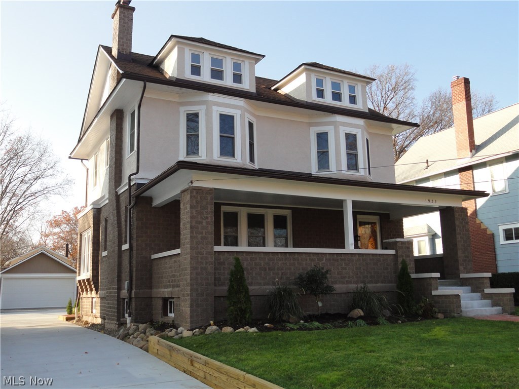 Welcome home to 1922 6th Street, a charming classic brick Colonial in a desirable Cuyahoga Falls location. Extensively and tastefully renovated throughout with careful attention to strive for excellence and quality with every detail. Large front porch steps in the foyer entry with marble floor and decorative pillars. Spacious living room with wood burning fireplace, high ceilings, crown molding and gorgeous hardwood floors that all continue into the formal dining and kitchen. The dining room has a window seat and floor to ceiling vintage built in cabinets with leaded glass doors and stained glass insert. The new kitchen is stunning, it has been opened to the dining room and has Tuscan styled cream cabinets, granite counters, tile back splash and high end stainless appliances. A mud room and 1/2 bath complete the first floor. The 2nd floor offers 3 light & bright bedrooms, 2 of them have bay windows, all with new carpet . Sparkling new main bathroom with jetted tub, separate showe