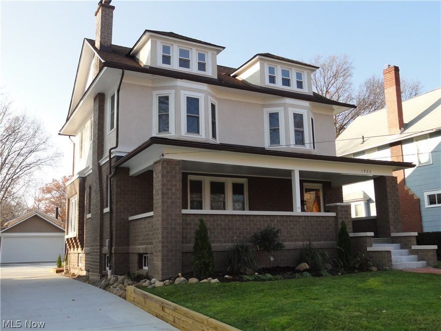 Welcome home to 1922 6th Street, a charming classic brick Colonial in a desirable Cuyahoga Falls location.  Extensively and tastefully renovated  throughout with careful attention to strive for excellence and quality with every detail.  Large front porch steps in the foyer entry with marble floor and decorative pillars.  Spacious living room with wood burning fireplace, high ceilings, crown molding and gorgeous hardwood floors that all continue into the formal dining and kitchen.  The dining room has a window seat and floor to ceiling vintage built in cabinets with leaded glass doors and stained glass insert. The new kitchen is stunning, it has been opened to the dining room and has Tuscan styled cream cabinets, granite counters, tile back splash and high end stainless appliances. A mud room and 1/2 bath complete the first floor.  The 2nd floor offers 3 light & bright bedrooms, 2 of them have bay windows, all with new carpet . Sparkling new main bathroom with jetted tub, separate showe