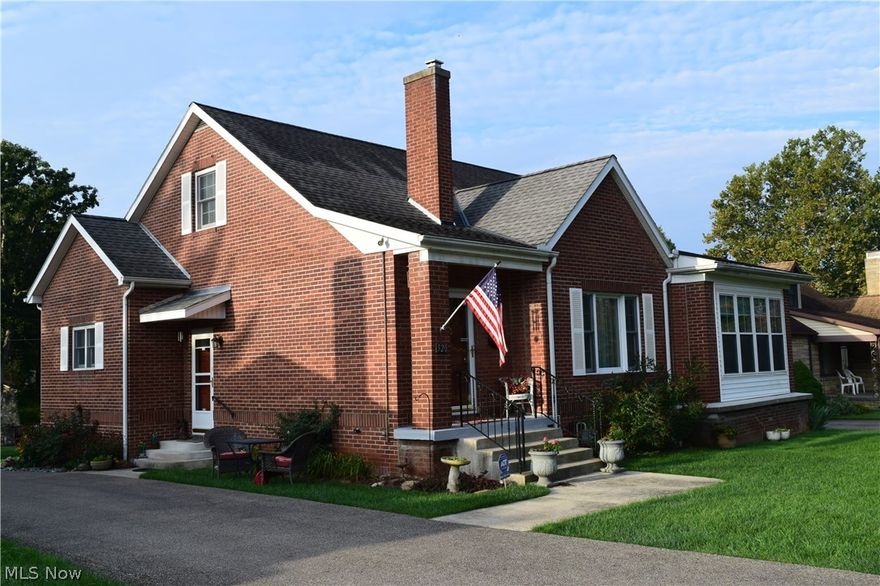 Meticulously maintained home with stunning old world charm! Solid brick with 2-car detached garage. Remodeled eat-in kitchen features new cabinets, counter tops, flooring & stainless steel appliances.Built in corner hutch in dining area, built in shelves in living room & built in cabinet in the hallway. Finished upstairs features gorgeous hardwood floors, remodeled half bath and finished walk-in attic (perfect for walk-in closet).Huge lower level with full bathroom and tile walls (very neat)! Main full bath features new sink & vanity. Original mosaic tile on floor and walls. Enjoy the sunroom with new Pergo flooring. 2 first floor bedrooms with double closets. Stone firepit in backyard. NEW driveway, sidewalk, steps, Italian iron railing at side & front, roof & windows