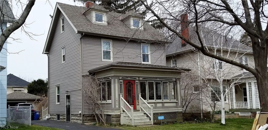 Awesome Lakewood home with finished attic! Great walkability to Lakewood’s restaurants and bars! From the moment you enter the enclosed front porch (heated) with oak flooring you know something special is right around the corner! Lovely formal living room with refinished maple hardwood floors, fireplace, and French doors leading out to the enclosed porch. Formal dining room with built-ins and window seat, sliders out to the landscaped backyard with coy pond and stone patio. Updated kitchen boasts stainless appliances (all stay) period correct tile flooring, and tons of storage! Second floor features 3 bedrooms, large updated bathroom with clawfoot tub, travertine floors, and additional storage area. Cute balcony is just beyond the bathroom! Third floor attic space is a great bonus room; potential office, additional family room, let your imagination take you to all the possibilities. Newer, oversized one car garage with tons of cabinets; plenty of room for projects! Updates include all